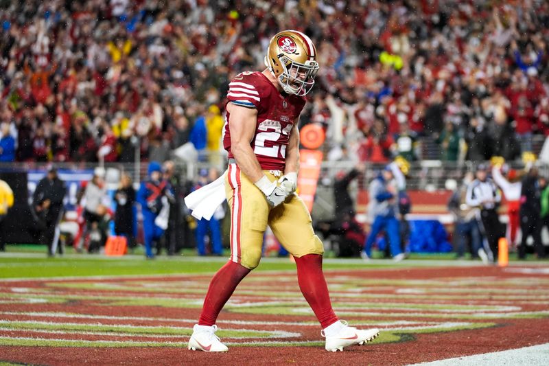 San Francisco 49ers running back Christian McCaffrey (23) celebrates after scoring a touchdown during an NFL football game against the Green Bay Packers Sunday, Jan. 21, 2024, in Santa Clara, Calif. (AP Photo/Ashley Landis)