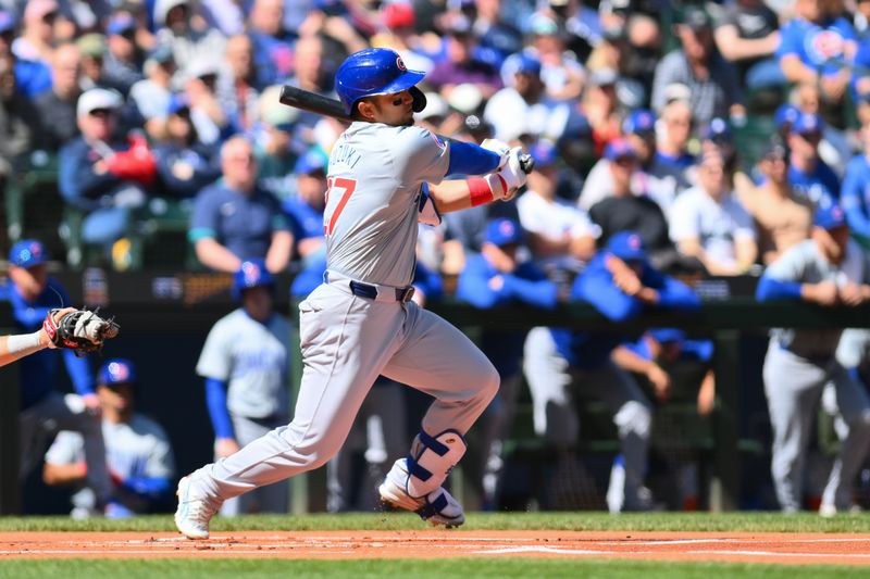 Apr 14, 2024; Seattle, Washington, USA; Chicago Cubs designated hitter Seiya Suzuki (27) hits a double against the Seattle Mariners during the first inning at T-Mobile Park. Mandatory Credit: Steven Bisig-USA TODAY Sports