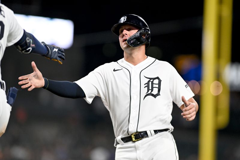 Aug 21, 2023; Detroit, Michigan, USA; Detroit Tigers first baseman Spencer Torkelson (20) celebrates after scoring a run against the Chicago Cubs in the ninth inning at Comerica Park. Mandatory Credit: Lon Horwedel-USA TODAY Sports