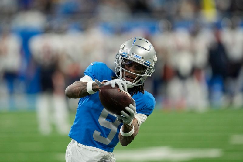 Detroit Lions wide receiver Jameson Williams warms up before the first half of an NFL football game against the Chicago Bears, Sunday, Jan. 1, 2023, in Detroit. (AP Photo/Paul Sancya)
