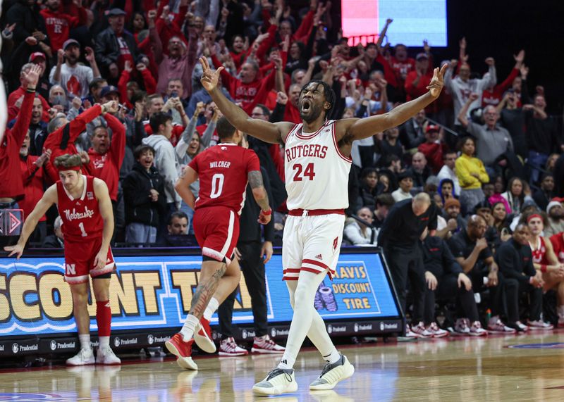 Jan 17, 2024; Piscataway, New Jersey, USA; Rutgers Scarlet Knights guard Austin Williams (24) reacts after making a three point basket during overtime against the Nebraska Cornhuskers  at Jersey Mike's Arena. Mandatory Credit: Vincent Carchietta-USA TODAY Sports