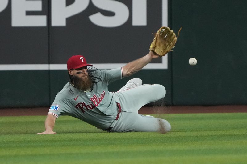Aug 11, 2024; Phoenix, Arizona, USA; Philadelphia Phillies outfielder Brandon Marsh (16) dives for the ball against the Arizona Diamondbacks in the third inning at Chase Field. Mandatory Credit: Rick Scuteri-USA TODAY Sports