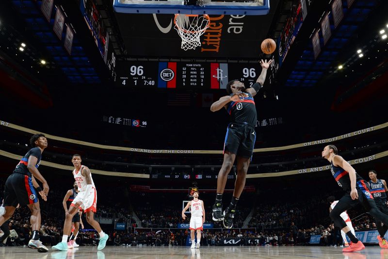 DETROIT, MI - JANUARY 12: Jalen Duren #0 of the Detroit Pistons rebounds the ball during the game against the Houston Rockets on January 12, 2024 at Little Caesars Arena in Detroit, Michigan. NOTE TO USER: User expressly acknowledges and agrees that, by downloading and/or using this photograph, User is consenting to the terms and conditions of the Getty Images License Agreement. Mandatory Copyright Notice: Copyright 2024 NBAE (Photo by Chris Schwegler/NBAE via Getty Images)