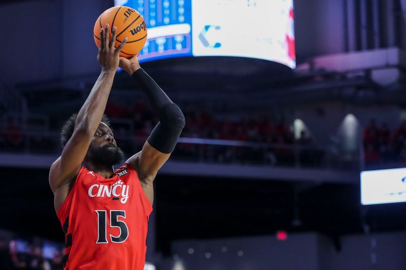 Mar 9, 2024; Cincinnati, Ohio, USA; Cincinnati Bearcats forward John Newman III (15) shoots against the West Virginia Mountaineers in the first half at Fifth Third Arena. Mandatory Credit: Katie Stratman-USA TODAY Sports