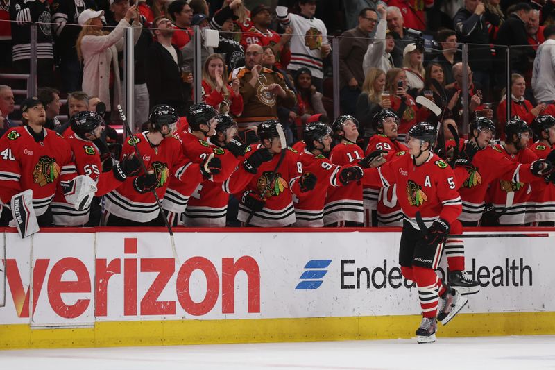 Apr 2, 2025; Chicago, Illinois, USA; 
Chicago Blackhawks defenseman Connor Murphy (5) celebrates a second period goal against the Colorado Avalanche at United Center. Mandatory Credit: Talia Sprague-Imagn Images