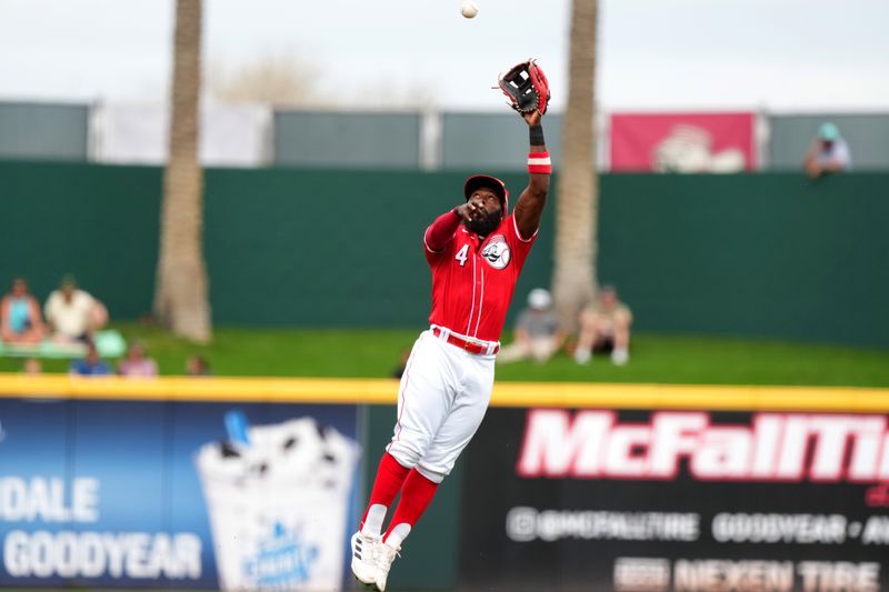 Feb 26, 2024; Goodyear, AZ, USA; Cincinnati Reds second baseman Josh Harrison leaps to catch a line drive for an out in the first inning during a MLB spring training baseball game against the Seattle Mariners, Monday, Feb. 26, 2024, at Goodyear Ballpark in Goodyear, Ariz. Mandatory Credit: Kareem Elgazzar-USA TODAY Sports