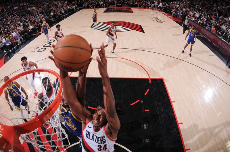 PORTLAND, OR - APRIL 11:  Jabari Walker #34 of the Portland Trail Blazers grabs the rebound during the game on April 11, 2024 at the Moda Center Arena in Portland, Oregon. NOTE TO USER: User expressly acknowledges and agrees that, by downloading and or using this photograph, user is consenting to the terms and conditions of the Getty Images License Agreement. Mandatory Copyright Notice: Copyright 2024 NBAE (Photo by Cameron Browne/NBAE via Getty Images)