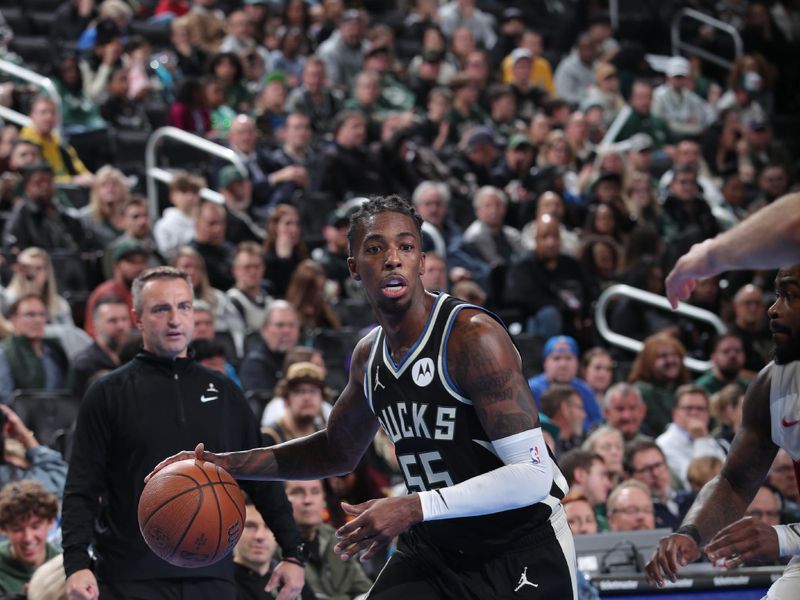 MILWAUKEE, WI - NOVEMBER 12: Delon Wright #55 of the Milwaukee Bucks dribbles the ball during the game against the Toronto Raptors  during the Emirates NBA Cup game on November 12, 2024 at Fiserv Forum Center in Milwaukee, Wisconsin. NOTE TO USER: User expressly acknowledges and agrees that, by downloading and or using this Photograph, user is consenting to the terms and conditions of the Getty Images License Agreement. Mandatory Copyright Notice: Copyright 2024 NBAE (Photo by Gary Dineen/NBAE via Getty Images).