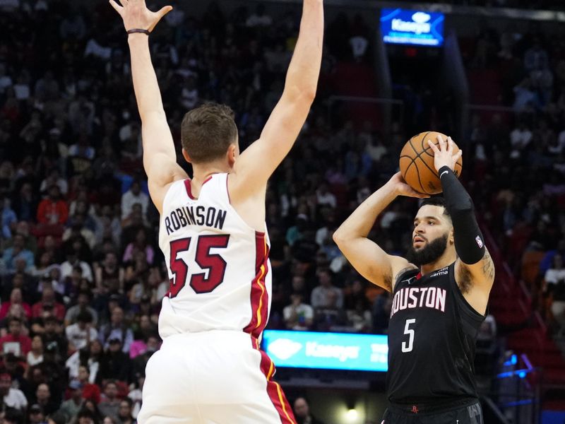 MIAMI, FLORIDA - JANUARY 08: Fred VanVleet #5 of the Houston Rockets looks to throw a pass against Duncan Robinson #55 of the Miami Heat during the second half at Kaseya Center on January 08, 2024 in Miami, Florida. NOTE TO USER: User expressly acknowledges and agrees that, by downloading and or using this photograph, User is consenting to the terms and conditions of the Getty Images License Agreement. (Photo by Rich Storry/Getty Images)