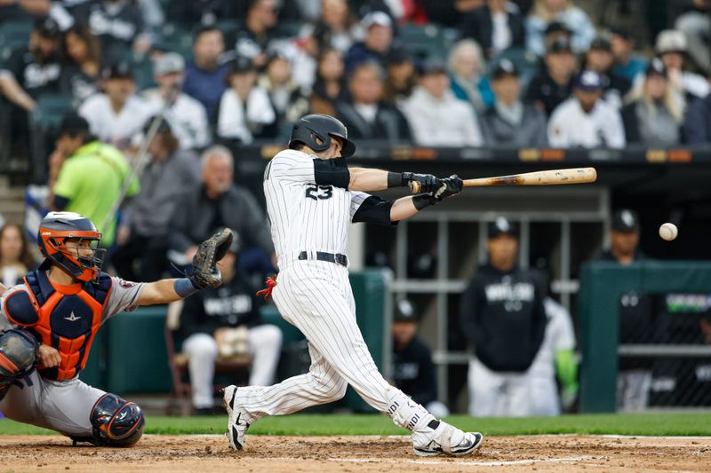 May 13, 2023; Chicago, Illinois, USA; Chicago White Sox left fielder Andrew Benintendi (23) singles against the Houston Astros during the third inning at Guaranteed Rate Field. Mandatory Credit: Kamil Krzaczynski-USA TODAY Sports