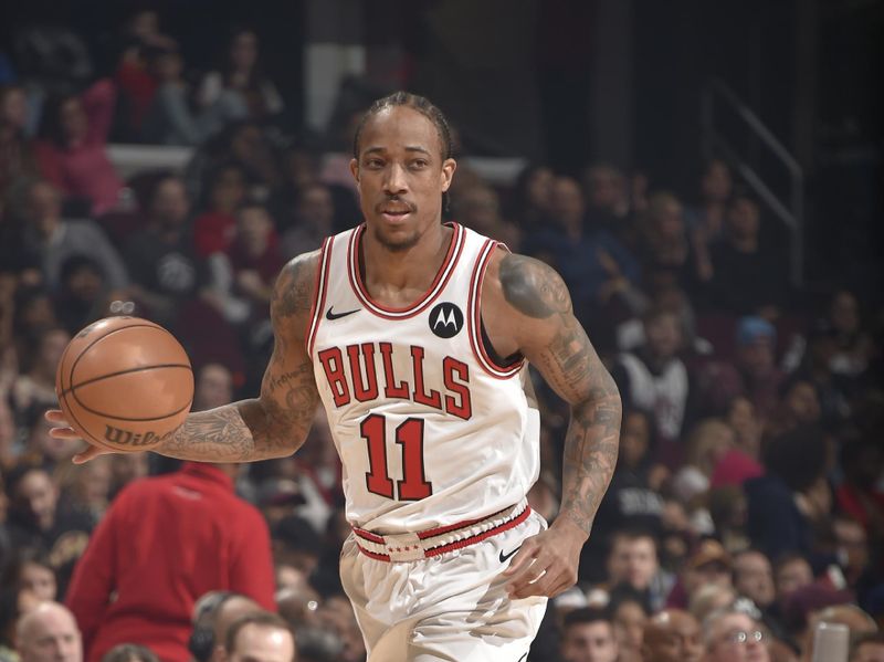 CLEVELAND, OH - FEBRUARY 14: DeMar DeRozan #11 of the Chicago Bulls dribbles the ball during the game against the Cleveland Cavaliers on February 14, 2024 at Rocket Mortgage FieldHouse in Cleveland, Ohio. NOTE TO USER: User expressly acknowledges and agrees that, by downloading and/or using this Photograph, user is consenting to the terms and conditions of the Getty Images License Agreement. Mandatory Copyright Notice: Copyright 2024 NBAE (Photo by David Liam Kyle/NBAE via Getty Images)