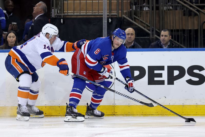 Mar 3, 2025; New York, New York, USA; New York Rangers left wing J.T. Miller (8) controls the puck against New York Islanders center Bo Horvat (14) during the second period at Madison Square Garden. Mandatory Credit: Brad Penner-Imagn Images
