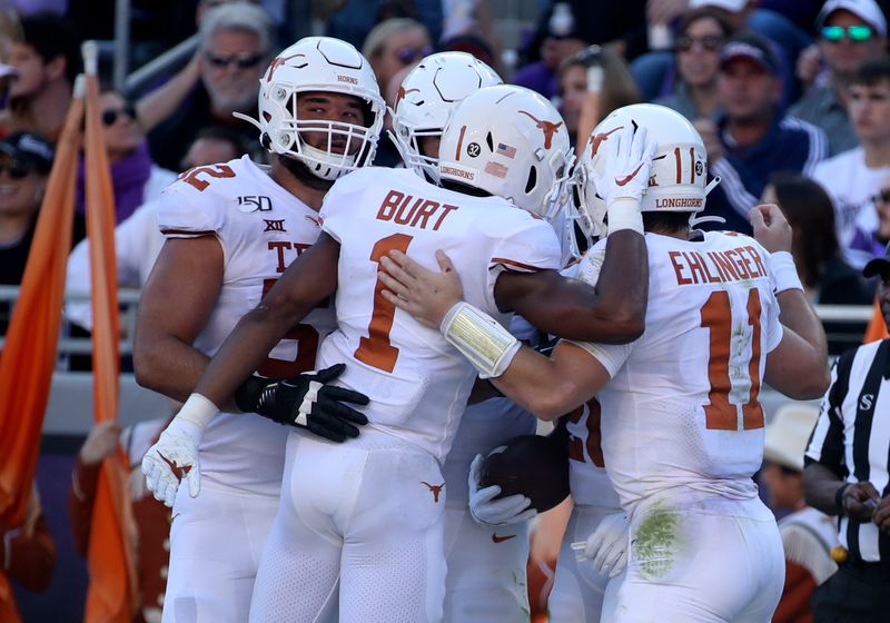 Oct 26, 2019; Fort Worth, TX, USA; Texas Longhorns quarterback Sam Ehlinger (11) celebrates with teammates after throwing a touchdown pass during the second quarter against the TCU Horned Frogs at Amon G. Carter Stadium. Mandatory Credit: Kevin Jairaj-USA TODAY Sports