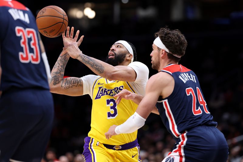 WASHINGTON, DC - APRIL 03: Anthony Davis #3 of the Los Angeles Lakers looses control of the ball in front of Corey Kispert #24 of the Washington Wizards during the first half at Capital One Arena on April 03, 2024 in Washington, DC. NOTE TO USER: User expressly acknowledges and agrees that, by downloading and or using this photograph, User is consenting to the terms and conditions of the Getty Images License Agreement. (Photo by Patrick Smith/Getty Images)