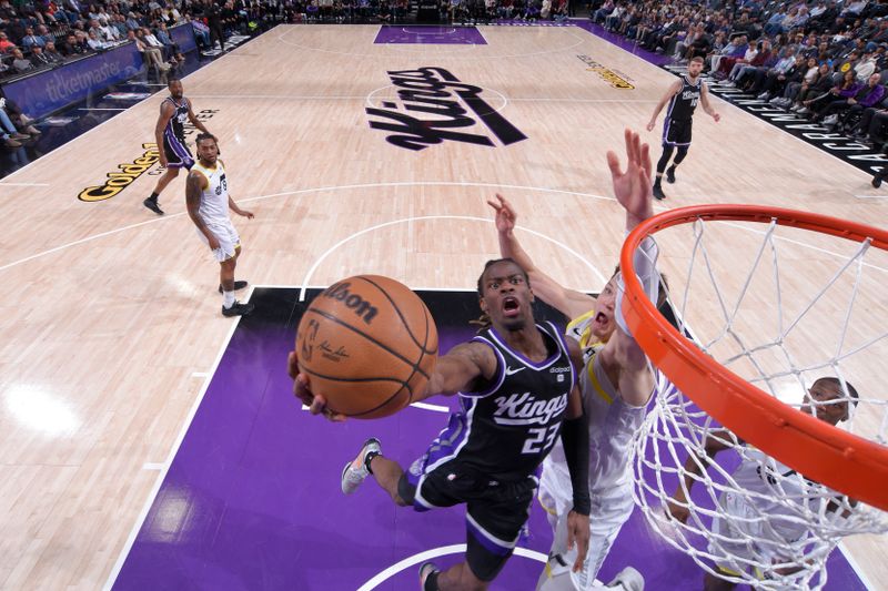 SACRAMENTO, CA - MARCH 31: Keon Ellis #23 of the Sacramento Kings drives to the basket during the game against the Utah Jazz on March 31, 2024 at Golden 1 Center in Sacramento, California. NOTE TO USER: User expressly acknowledges and agrees that, by downloading and or using this Photograph, user is consenting to the terms and conditions of the Getty Images License Agreement. Mandatory Copyright Notice: Copyright 2024 NBAE (Photo by Rocky Widner/NBAE via Getty Images)