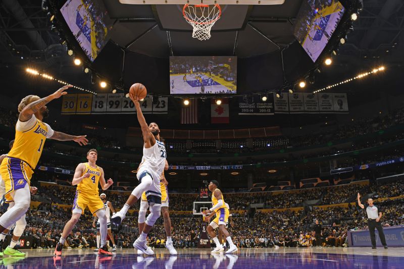 LOS ANGELES, CA - OCTOBER 22: Rudy Gobert #27 of the Minnesota Timberwolves drives to the basket during the game against the Los Angeles Lakers on October 22, 2024 at Crypto.Com Arena in Los Angeles, California. NOTE TO USER: User expressly acknowledges and agrees that, by downloading and/or using this Photograph, user is consenting to the terms and conditions of the Getty Images License Agreement. Mandatory Copyright Notice: Copyright 2024 NBAE (Photo by Adam Pantozzi/NBAE via Getty Images)