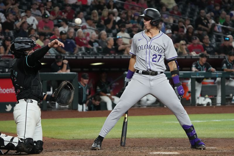 Aug 14, 2024; Phoenix, Arizona, USA; Colorado Rockies outfielder Jordan Beck (27) reacts after a called strike in the eighth inning against the Arizona Diamondbacks at Chase Field. Mandatory Credit: Rick Scuteri-USA TODAY Sports