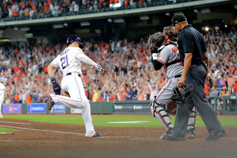 Sep 20, 2023; Houston, Texas, USA; Houston Astros catcher Yainer Diaz (21) crosses home plate to score the winning run against the Baltimore Orioles during the ninth inning at Minute Maid Park. Mandatory Credit: Erik Williams-USA TODAY Sports