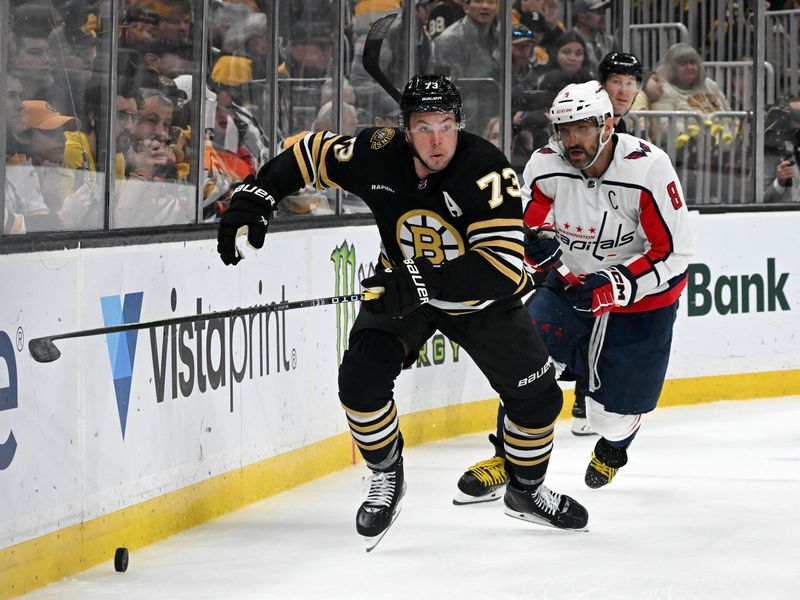 Feb 10, 2024; Boston, Massachusetts, USA; Boston Bruins defenseman Charlie McAvoy (73) skates against Washington Capitals left wing Alex Ovechkin (8) during the second period at the TD Garden. Mandatory Credit: Brian Fluharty-USA TODAY Sports