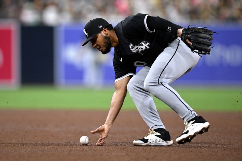 Sep 21, 2024; San Diego, California, USA; Chicago White Sox second baseman Lenyn Sosa (50) fields a ground ball bare-handed during the fifth inning against the San Diego Padres at Petco Park. Mandatory Credit: Orlando Ramirez-Imagn Images