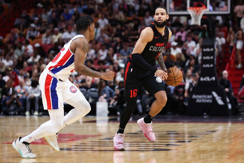 MIAMI, FLORIDA - MARCH 05: Caleb Martin #16 of the Miami Heat dribbles the ball against Marcus Sasser #25 of the Detroit Pistons during the first quarter of the game at Kaseya Center on March 05, 2024 in Miami, Florida. NOTE TO USER: User expressly acknowledges and agrees that, by downloading and or using this photograph, User is consenting to the terms and conditions of the Getty Images License Agreement. (Photo by Megan Briggs/Getty Images)