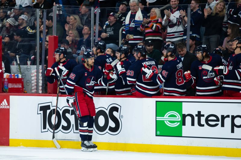 Feb 10, 2024; Winnipeg, Manitoba, CAN;  Winnipeg Jets forward Nino Niederreiter (62) celebrates with teammates after scoring a goal against the Pittsburgh Penguins during the first period at Canada Life Centre. Mandatory Credit: Terrence Lee-USA TODAY Sports