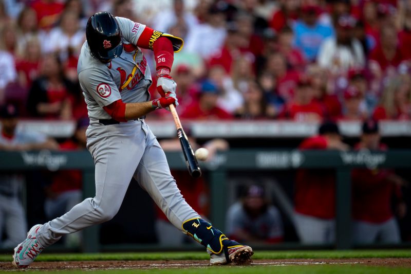 May 28, 2024; Cincinnati, Ohio, USA; St. Louis Cardinals third baseman Nolan Arenado (28) hits a 2-run home run in the fourth inning at Great American Ball Park. Mandatory Credit: Albert Cesare-USA TODAY Sports