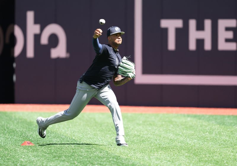 Jun 30, 2024; Toronto, Ontario, CAN; New York Yankees pitcher Luis Gil (81) throws balls during batting practice before game against the Toronto Blue Jays at Rogers Centre. Mandatory Credit: Nick Turchiaro-USA TODAY Sports