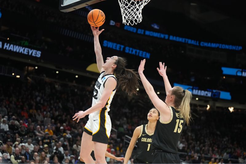 Mar 24, 2023; Seattle, WA, USA; Iowa Hawkeyes guard Caitlin Clark (22) shoots the ball against Colorado Buffaloes guard Kindyll Wetta (15) in the first half at Climate Pledge Arena. Mandatory Credit: Kirby Lee-USA TODAY Sports