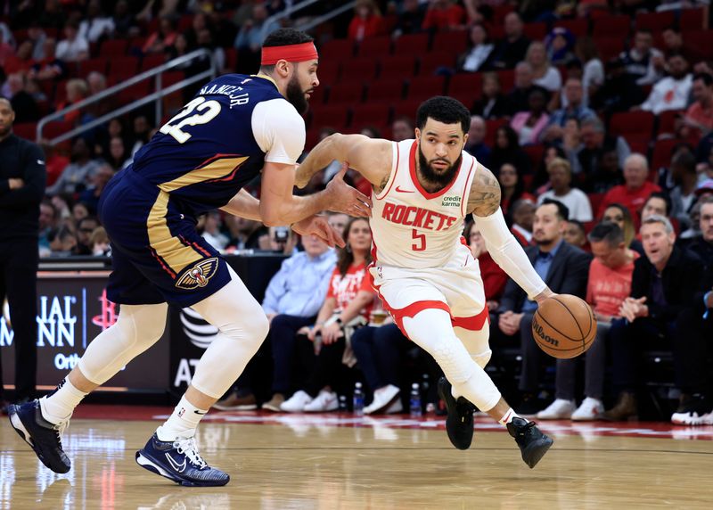 HOUSTON, TEXAS - JANUARY 31: Fred VanVleet #5 of the Houston Rockets dries around Larry Nance Jr. #22 of the New Orleans Pelicans during the first half at Toyota Center on January 31, 2024 in Houston, Texas. NOTE TO USER: User expressly acknowledges and agrees that, by downloading and or using this photograph, User is consenting to the terms and conditions of the Getty Images License Agreement.? (Photo by Carmen Mandato/Getty Images)