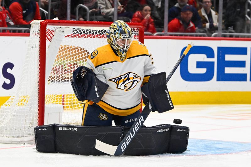 Dec 30, 2023; Washington, District of Columbia, USA; Nashville Predators goaltender Yaroslav Askarov (30) makes a save against the Washington Capitals during the first period at Capital One Arena. Mandatory Credit: Brad Mills-USA TODAY Sports