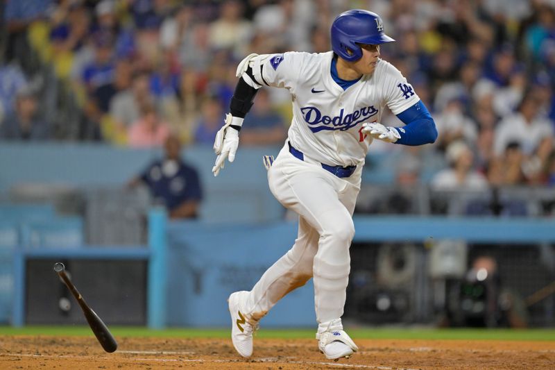 Jun 21, 2024; Los Angeles, California, USA;  Los Angeles Dodgers designated hitter Shohei Ohtani (17) runs out an infield hit in the eighth inning against the Los Angeles Angels at Dodger Stadium. Mandatory Credit: Jayne Kamin-Oncea-USA TODAY Sports