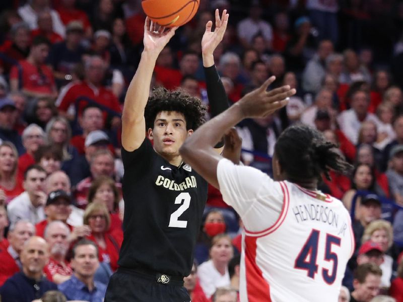 Feb 18, 2023; Tucson, Arizona, USA; Colorado Buffaloes guard KJ Simpson (2) makes a basket against Arizona Wildcats guard Cedric Henderson Jr. (45) during the first half at McKale Center. Mandatory Credit: Zachary BonDurant-USA TODAY Sports