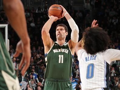 MILWAUKEE, WI - DECEMBER 21: Brook Lopez #11 of the Milwaukee Bucks shoots the ball during the game against the Orlando Magic on December 21, 2023 at the Fiserv Forum Center in Milwaukee, Wisconsin. NOTE TO USER: User expressly acknowledges and agrees that, by downloading and or using this Photograph, user is consenting to the terms and conditions of the Getty Images License Agreement. Mandatory Copyright Notice: Copyright 2023 NBAE (Photo by Gary Dineen/NBAE via Getty Images).