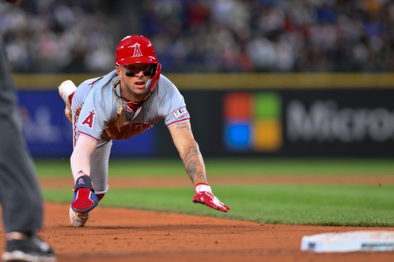 May 31, 2024; Seattle, Washington, USA; Los Angeles Angels shortstop Zach Neto (9) steals third base during the seventh inning against the Seattle Mariners at T-Mobile Park. Mandatory Credit: Steven Bisig-USA TODAY Sports