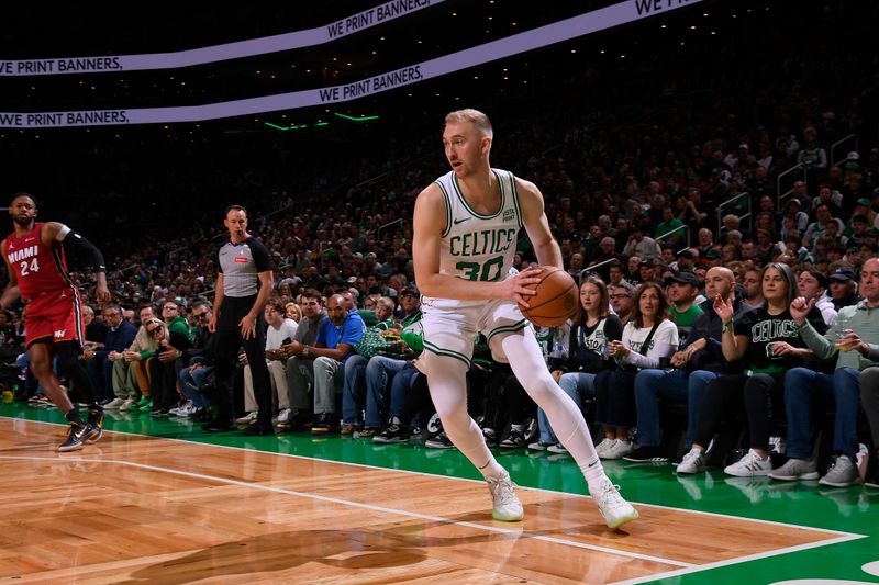 BOSTON, MA - APRIL 21: Sam Hauser #30 of the Boston Celtics handles the ball during the game against the Miami Heat during Round 1 Game 1 of the 2024 NBA Playoffs on April 21, 2024 at the TD Garden in Boston, Massachusetts. NOTE TO USER: User expressly acknowledges and agrees that, by downloading and or using this photograph, User is consenting to the terms and conditions of the Getty Images License Agreement. Mandatory Copyright Notice: Copyright 2024 NBAE  (Photo by Brian Babineau/NBAE via Getty Images)