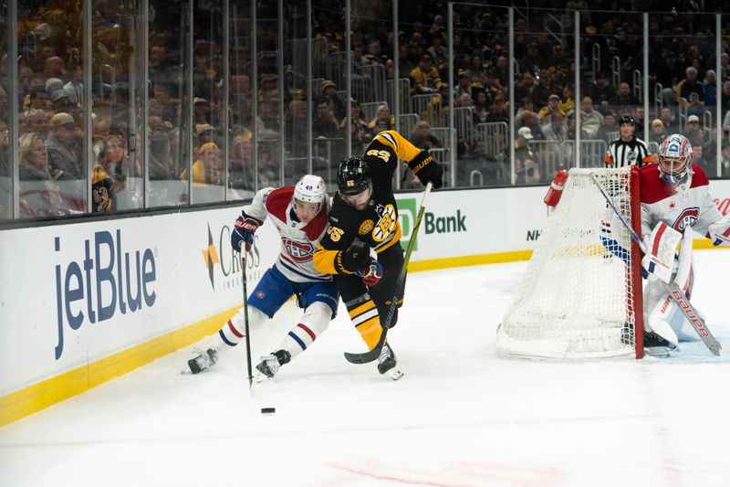 Dec 1, 2024; Boston, Massachusetts, USA; Boston Bruins right wing Justin Brazeau (55) and Montreal Canadiens defenseman Lane Hutson (48) battle for the puck during a game at the TD Garden. Mandatory Credit: Natalie Reid-Imagn Images