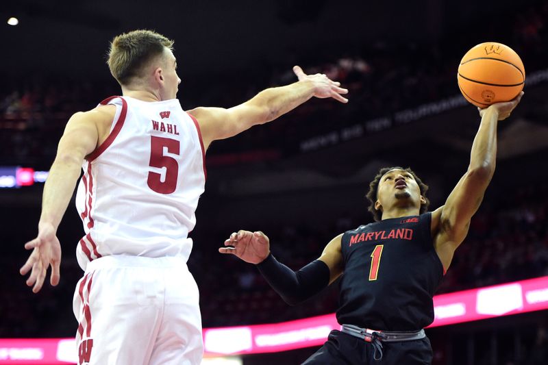 Dec 6, 2022; Madison, Wisconsin, USA;  Maryland Terrapins guard Jahmir Young (1) shoots under coverage by Wisconsin Badgers forward Tyler Wahl (5) during the first half at the Kohl Center. Mandatory Credit: Kayla Wolf-USA TODAY Sports