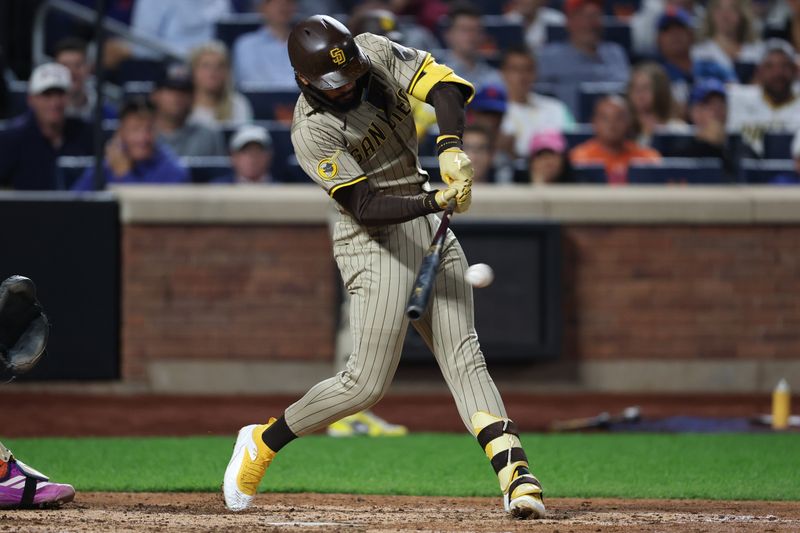 Sep 17, 2025; New York City, New York, USA; San Diego Padres right fielder Fernando Tatis Jr. (23) singles sixth inningd against the New York Mets at Citi Field. Mandatory Credit: Vincent Carchietta-Imagn Images