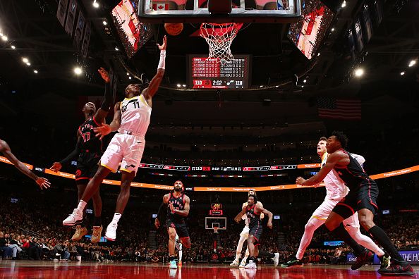 TORONTO, CANADA - DECEMBER 23:  Kris Dunn #11 of the Utah Jazz drives to the basket during the game against the Toronto Raptors on December 23, 2023 at the Scotiabank Arena in Toronto, Ontario, Canada.  NOTE TO USER: User expressly acknowledges and agrees that, by downloading and or using this Photograph, user is consenting to the terms and conditions of the Getty Images License Agreement.  Mandatory Copyright Notice: Copyright 2023 NBAE (Photo by Vaughn Ridley/NBAE via Getty Images)