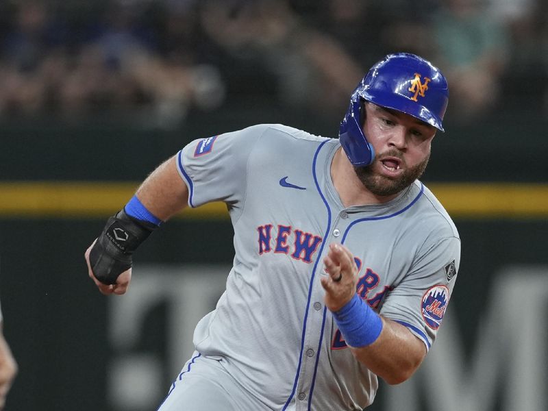 Jun 17, 2024; Arlington, Texas, USA; New York Mets right fielder DJ Stewart (29) runs to third base on a single hit by third baseman Mark Vientos (not shown) against the Texas Rangers during the sixth inning at Globe Life Field. Mandatory Credit: Jim Cowsert-USA TODAY Sports