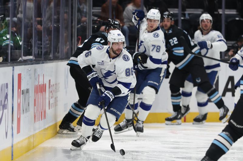 Nov 2, 2025; Salt Lake City, Utah, USA; Tampa Bay Lightning right wing Nikita Kucherov (86) moves the puck against the Utah Mammoth during the second period at Delta Center. Mandatory Credit: Rob Gray-Imagn Images