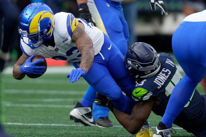 Los Angeles Rams running back Kyren Williams, left, is tackled against Seattle Seahawks linebacker Ernest Jones IV during the first half of an NFL football game in Seattle, Sunday, Nov. 3, 2024. (AP Photo/Stephen Brashear)