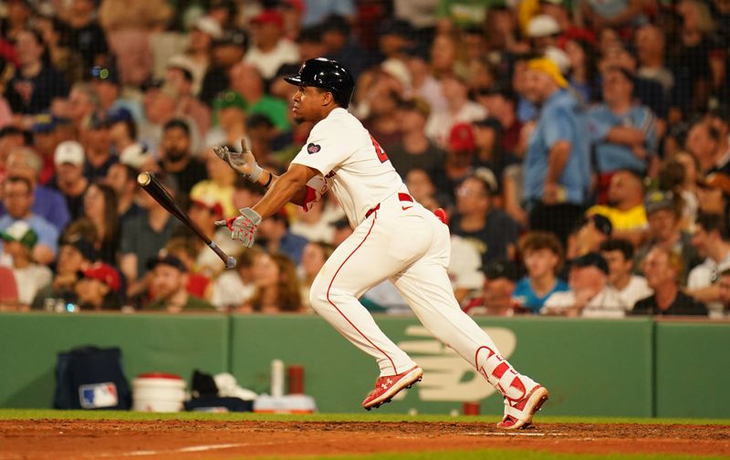 Jun 13, 2024; Boston, Massachusetts, USA; Boston Red Sox second baseman Enmanuel Valdez (47) hits a double stretched to third and tagged out against the Philadelphia Phillies in the sixth inning at Fenway Park. Mandatory Credit: David Butler II-USA TODAY Sports