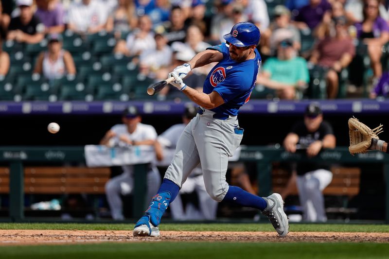 Sep 15, 2024; Denver, Colorado, USA; Chicago Cubs pinch hitter Mike Tauchman (40) hits a single in the eighth inning against the Colorado Rockies at Coors Field. Mandatory Credit: Isaiah J. Downing-Imagn Images