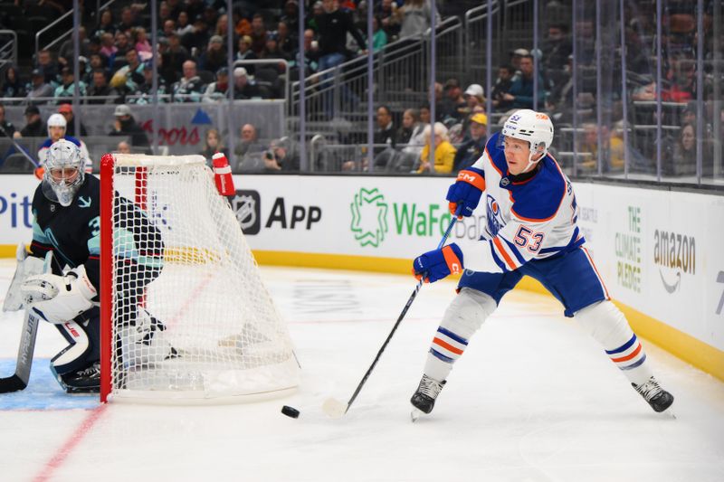 Oct 2, 2024; Seattle, Washington, USA; Edmonton Oilers center Jeff Skinner (53) passes the puck against the Seattle Kraken during the second period at Climate Pledge Arena. Mandatory Credit: Steven Bisig-Imagn Images