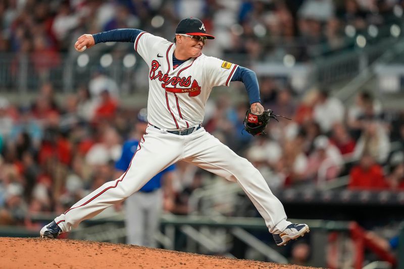 Sep 27, 2023; Cumberland, Georgia, USA; Atlanta Braves relief pitcher Jesse Chavez (60) pitches against the Chicago Cubs during the tenth inning at Truist Park. Mandatory Credit: Dale Zanine-USA TODAY Sports