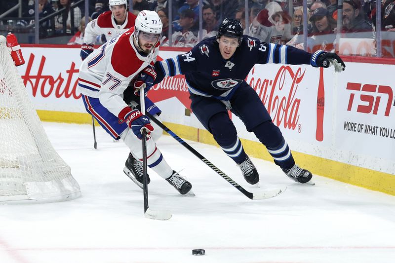 Dec 14, 2024; Winnipeg, Manitoba, CAN;  Montreal Canadiens center Kirby Dach (77) is chased down by Winnipeg Jets defenseman Logan Stanley (64) in the first period at Canada Life Centre. Mandatory Credit: James Carey Lauder-Imagn Images