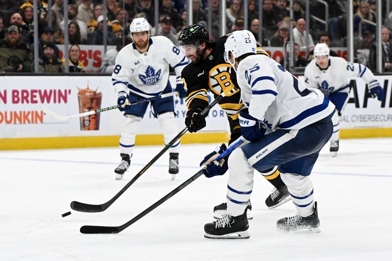 Nov 11, 2025; Boston, Massachusetts, USA; Boston Bruins center Mark Kastelic (47) controls the puck against Toronto Maple Leafs defenseman Brandon Carlo (25) during the third period at the TD Garden. Mandatory Credit: Brian Fluharty-Imagn Images