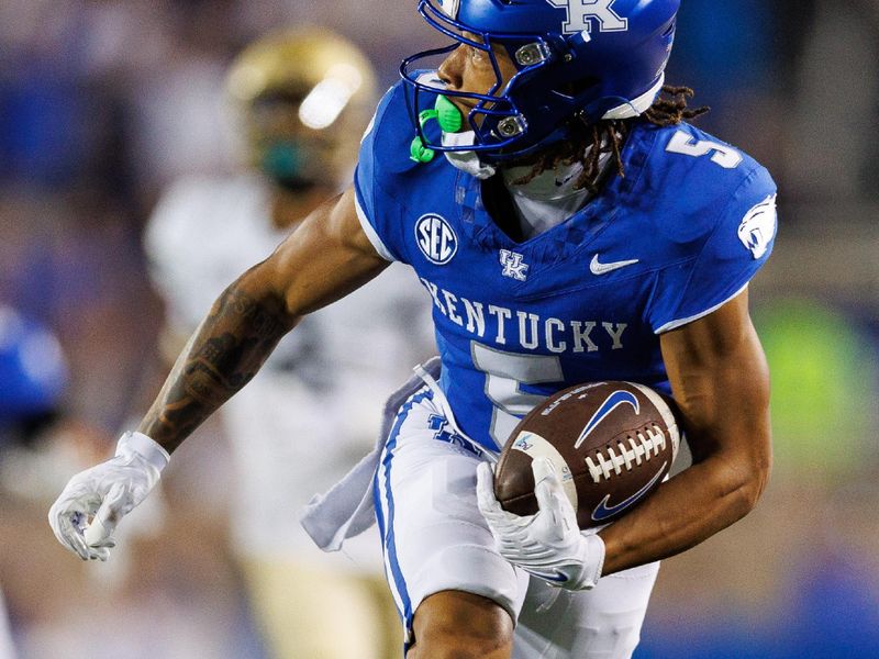 Sep 16, 2023; Lexington, Kentucky, USA; Kentucky Wildcats wide receiver Anthony Brown-Stephens (5) runs the ball into the end zone but holding was called on the offense during the third quarter against the Akron Zips at Kroger Field. Mandatory Credit: Jordan Prather-USA TODAY Sports